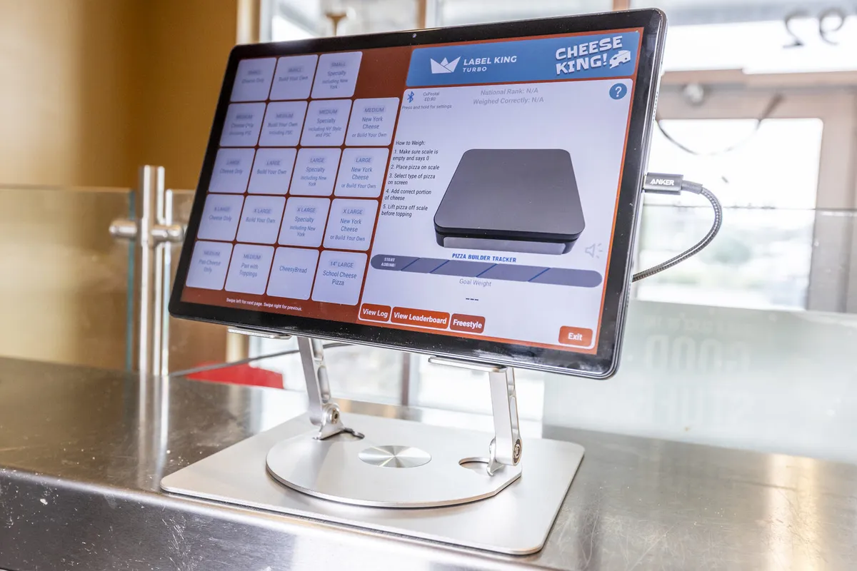 Portion King tablet running the Cheese King scale app on a kitchen counter stand